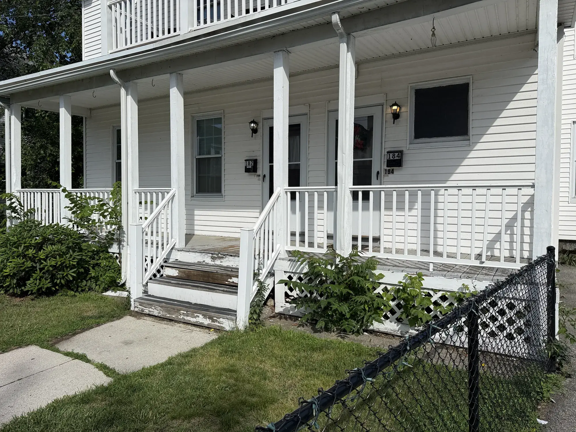 Before: a front porch staircase with peeling, weathered paint on the treads
