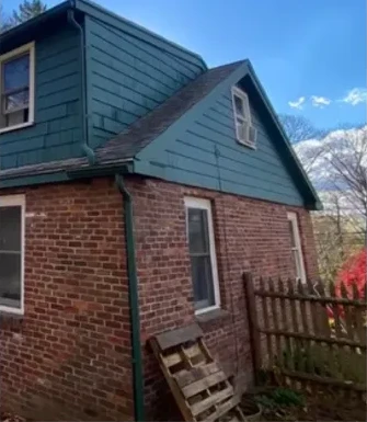 Blue-green exterior siding following a Proper Paint repair and repaint project